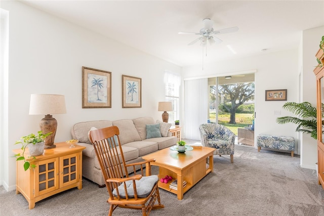 living room featuring carpet and ceiling fan