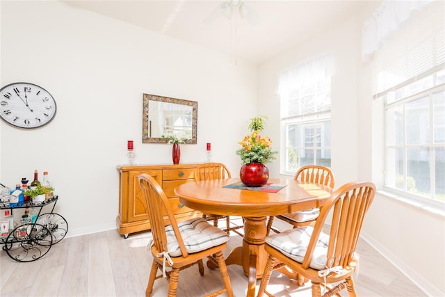 dining area featuring a wealth of natural light and light hardwood / wood-style floors