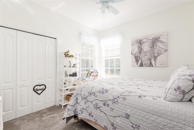 carpeted bedroom with a closet and ceiling fan