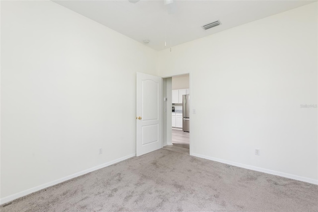 5733 Heronpark Pl, Lithia, FL 33547 - unfurnished room with light carpet and ceiling fan