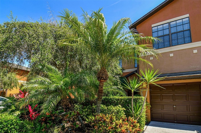 view of property exterior with a garage