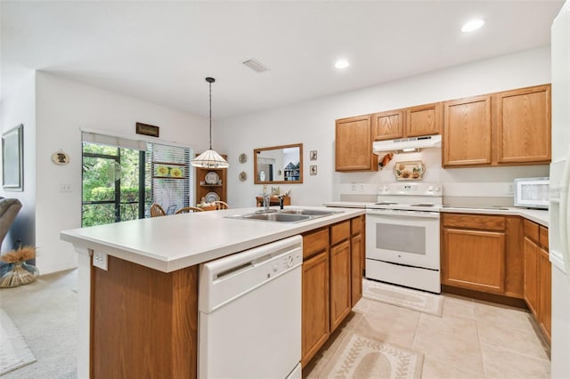 kitchen featuring sink, pendant lighting, white appliances, a center island with sink, and light tile patterned flooring