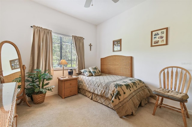 bedroom with ceiling fan and light carpet