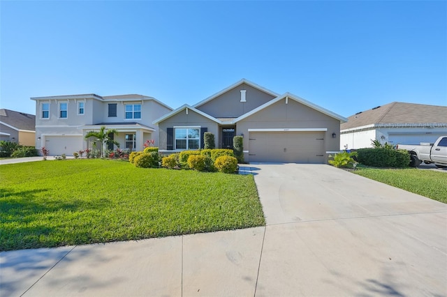 view of front of house with a front yard and a garage