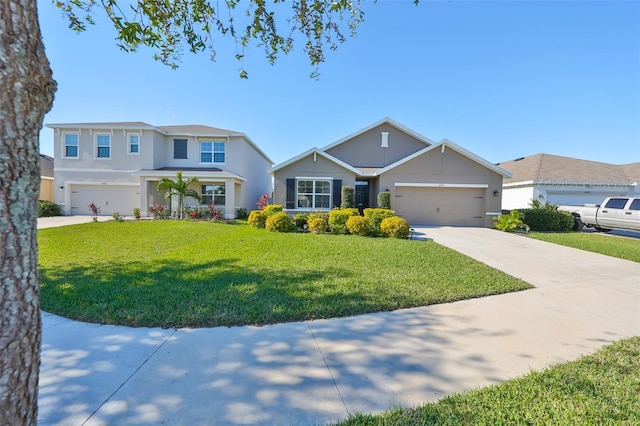 view of front of home featuring a front yard and a garage