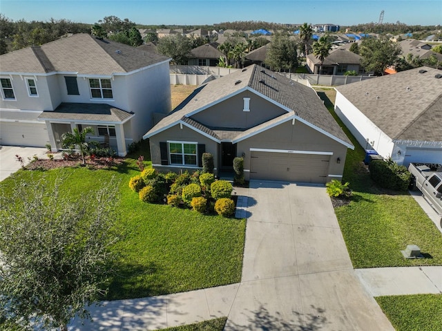 view of front of house with a garage and a front yard