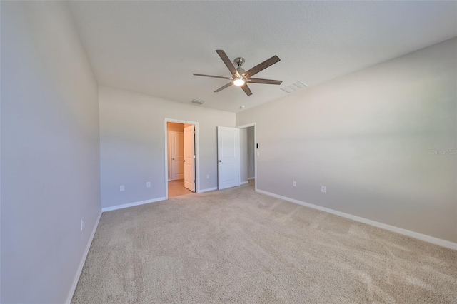 unfurnished bedroom featuring ceiling fan and light carpet