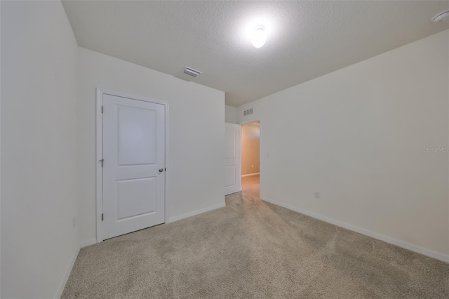 spare room featuring a textured ceiling