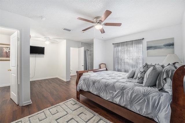 bedroom featuring ceiling fan, dark hardwood / wood-style floors, and a textured ceiling