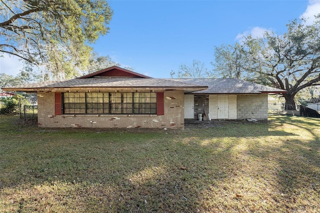 ranch-style house with a front lawn