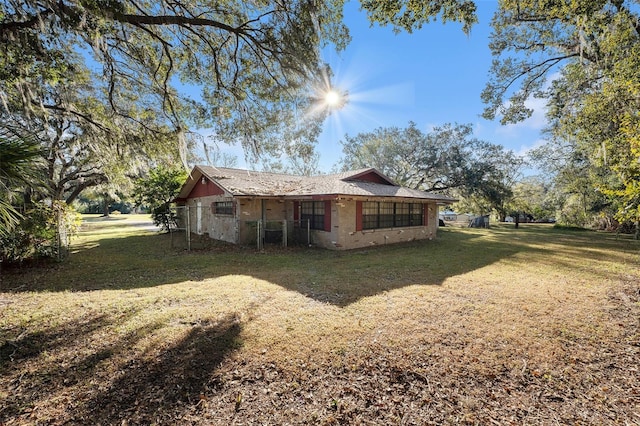 view of property exterior with a yard