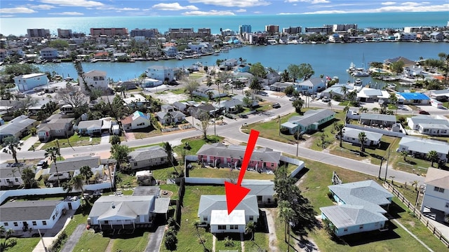 birds eye view of property featuring a water view