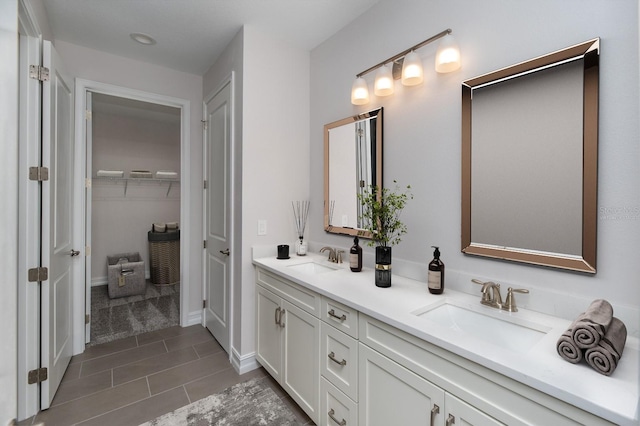 bathroom with tile patterned floors and vanity