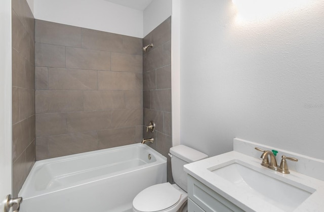 full bathroom with vanity, toilet, and tiled shower / bath