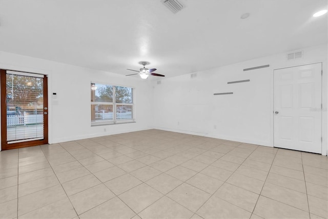 unfurnished room featuring light tile patterned floors and ceiling fan