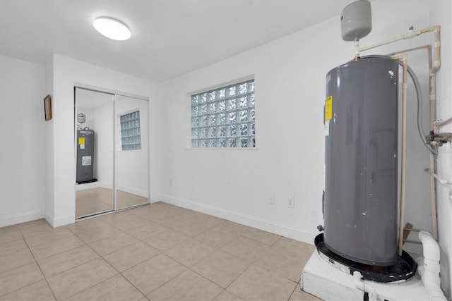 utility room featuring electric water heater