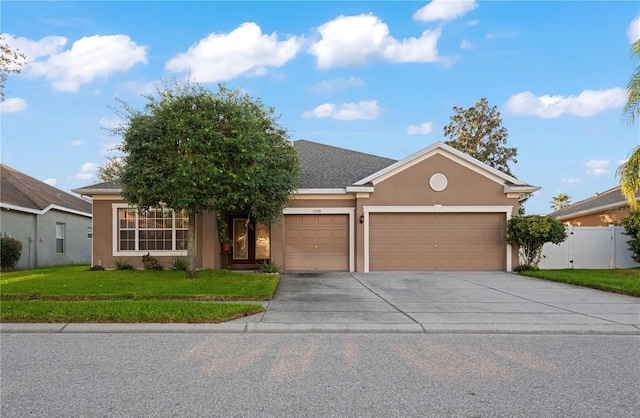 view of front of house featuring a front yard and a garage