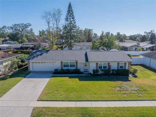 single story home featuring a front yard and a garage