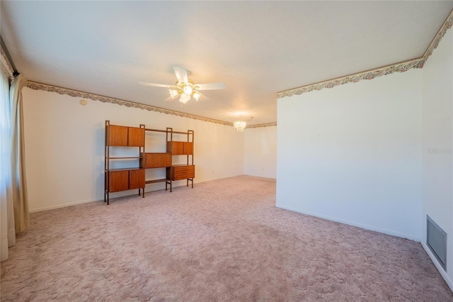 carpeted empty room featuring ceiling fan