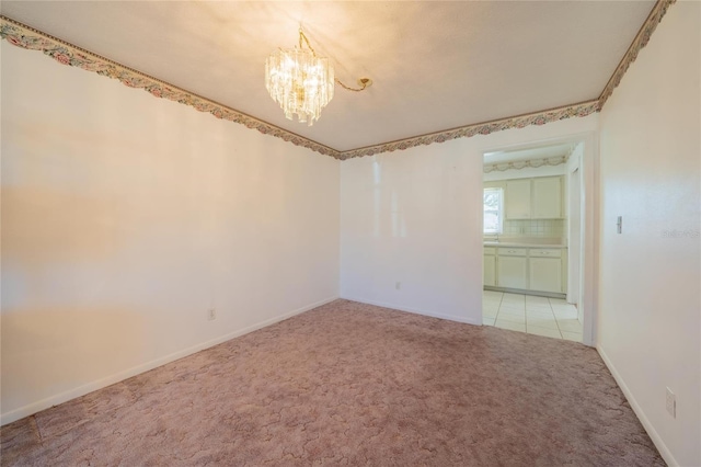 unfurnished room featuring light colored carpet and an inviting chandelier