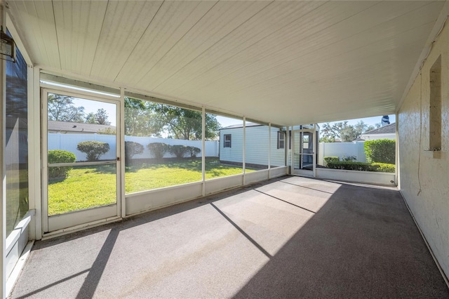 unfurnished sunroom with plenty of natural light