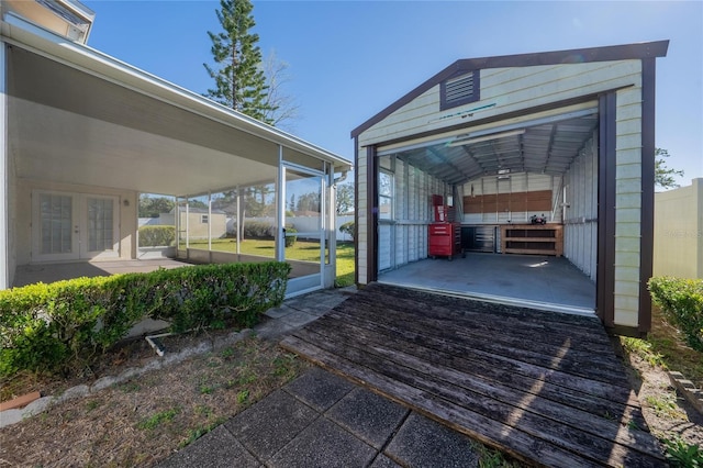 view of vehicle parking featuring french doors