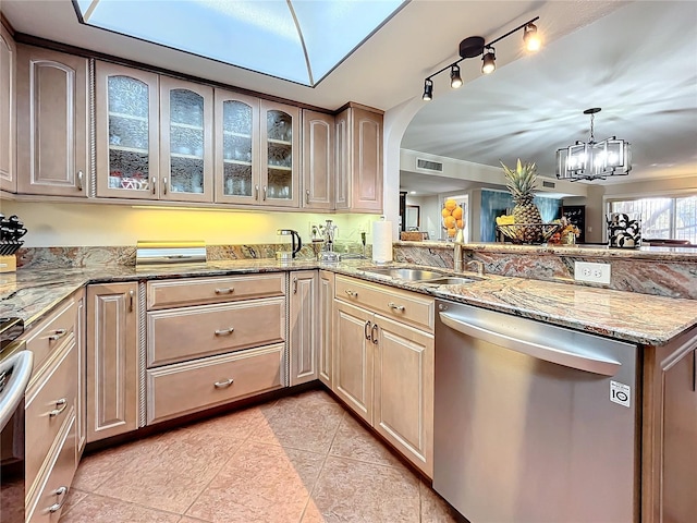 kitchen featuring kitchen peninsula, dishwasher, a chandelier, and sink