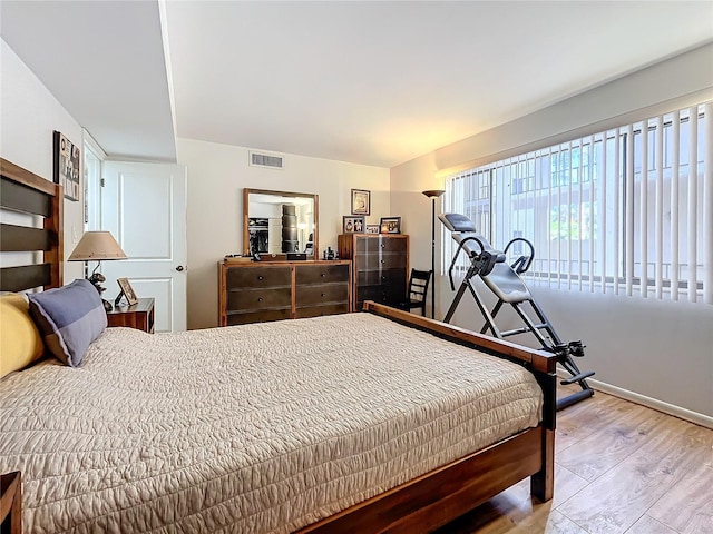 bedroom with light hardwood / wood-style flooring