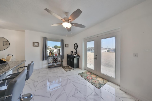 office area featuring ceiling fan and french doors