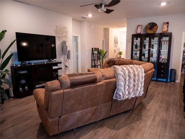 living room with hardwood / wood-style floors and ceiling fan