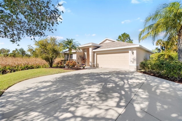 view of front of house featuring a front yard and a garage