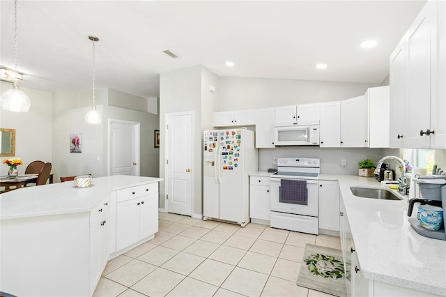 kitchen featuring white cabinets, sink, a center island, and white appliances