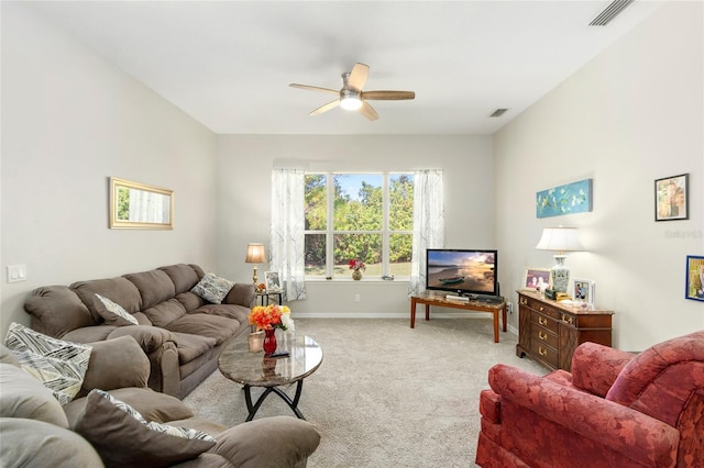 carpeted living room featuring ceiling fan