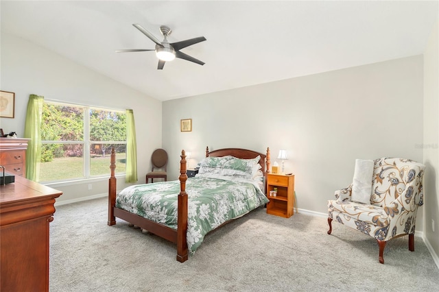 carpeted bedroom featuring ceiling fan and vaulted ceiling