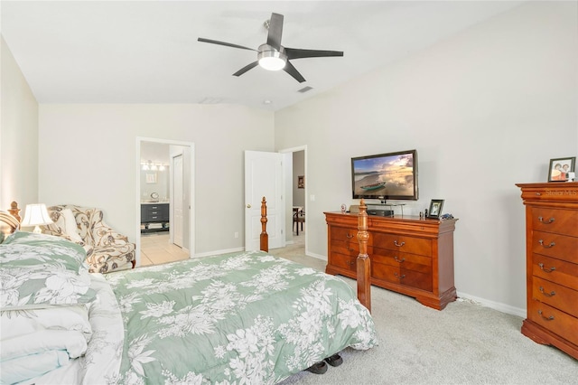 carpeted bedroom featuring ceiling fan, ensuite bathroom, and lofted ceiling