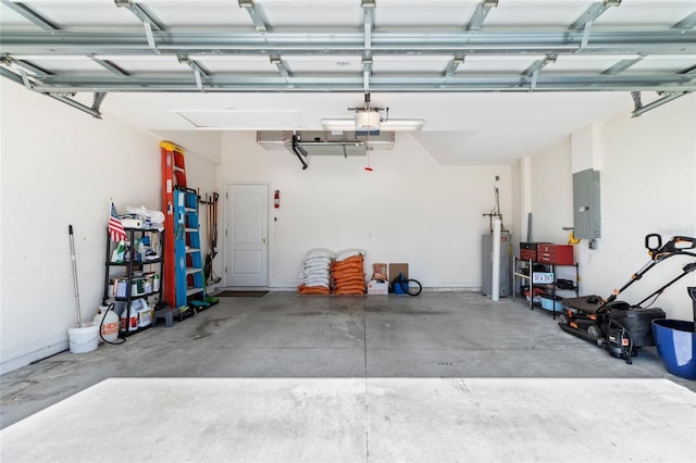 garage with electric water heater and electric panel