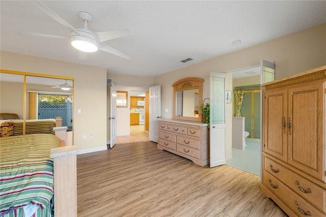 bedroom featuring ceiling fan, ensuite bathroom, and light hardwood / wood-style flooring