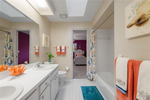 full bathroom with shower / tub combo with curtain, vanity, and toilet