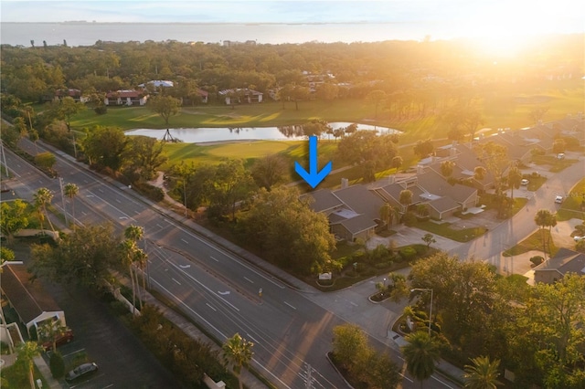 aerial view at dusk with a water view