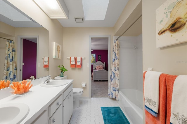 3401 Avenida Madera Unit B, Bradenton, FL 34210 - full bathroom featuring double vanity, toilet, tile patterned floors, shower / bathtub combination with curtain, and baseboards
