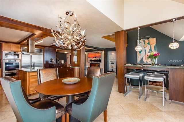 tiled dining room with an inviting chandelier