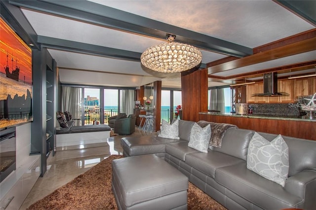 living room with beam ceiling and a notable chandelier