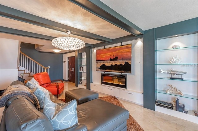 living room featuring a notable chandelier, a textured ceiling, beam ceiling, and built in shelves