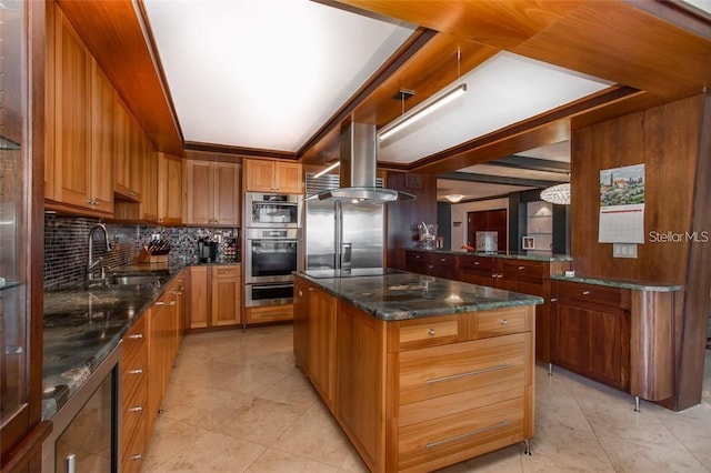 kitchen with a center island, island exhaust hood, stainless steel appliances, sink, and backsplash