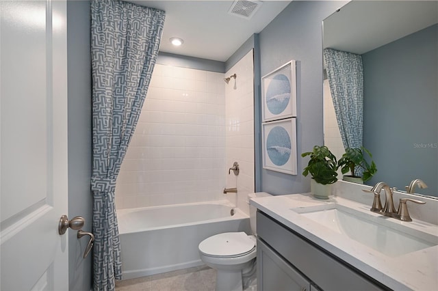 full bathroom featuring shower / bath combo, vanity, and toilet