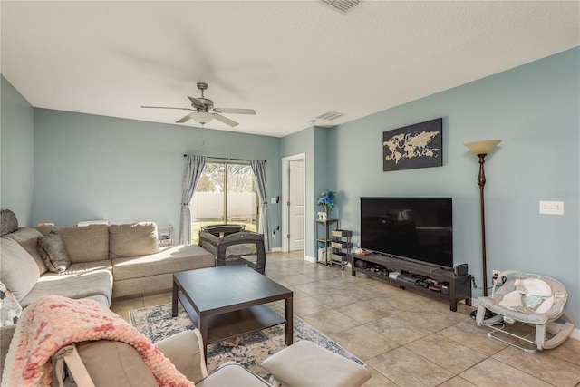 living room featuring ceiling fan and light tile patterned flooring