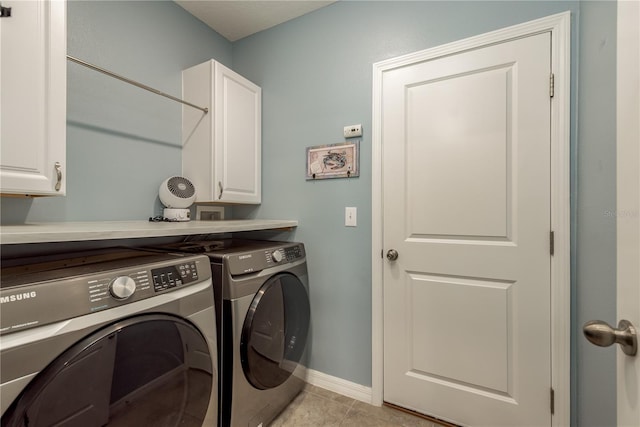 laundry room with cabinets, separate washer and dryer, and light tile patterned floors