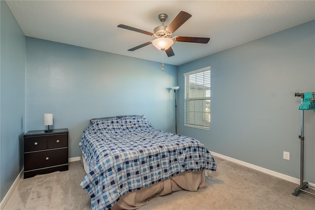 bedroom with ceiling fan and light colored carpet