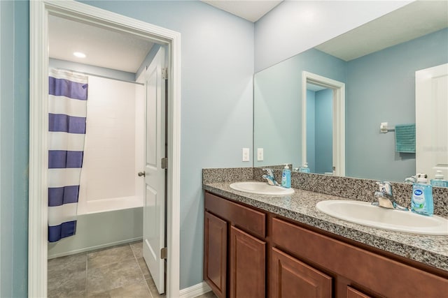 bathroom with tile patterned flooring, vanity, and shower / bathtub combination with curtain