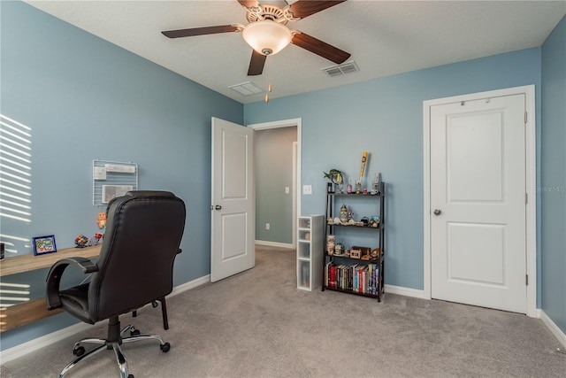 carpeted office with ceiling fan